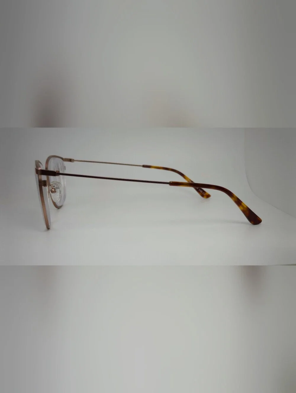 Vita. Metal Frame Eyeglasses in Copper Brown. Tortoise Temple Tips.